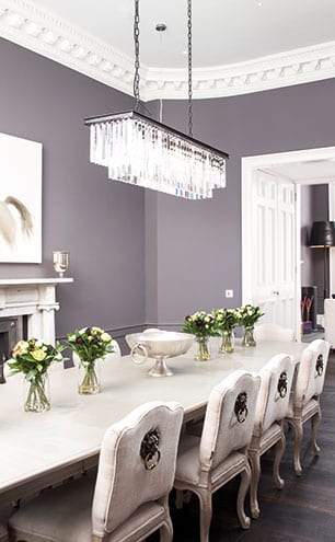 Zoffany grey walls keep the dining room formal but soft and allow the Murano glass light to be the focus. [