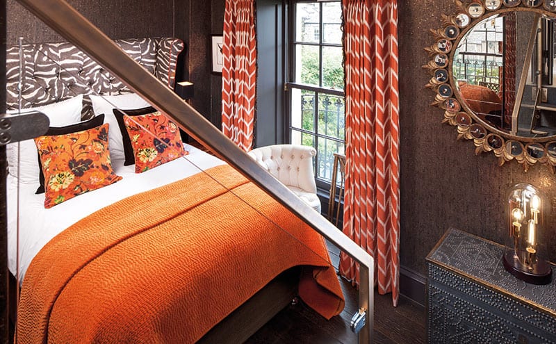 Animal prints and orange tones give the guest room a playful feel.