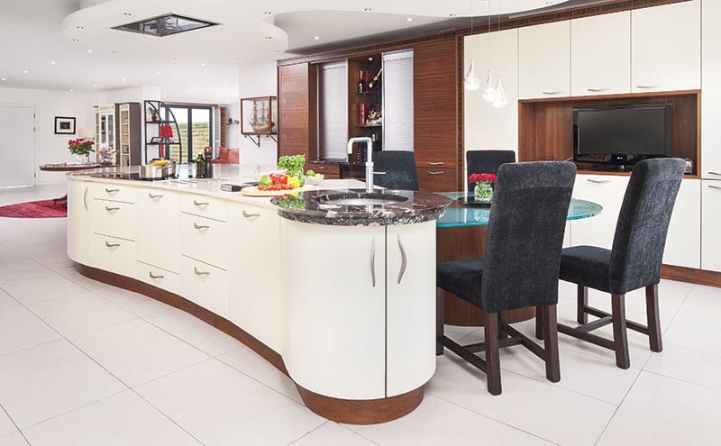 Part of the designer’s task was to create distinct zones within the kitchen – a place for relaxing, a work station for food prep, a spot for mixing drinks and so on. The island’s curves help this to look and feel natural