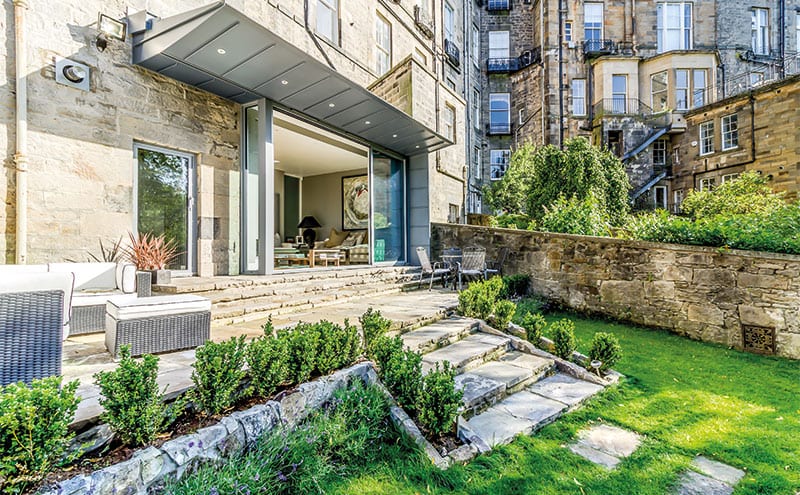 A view of the extension and its thin cantilevered roof. The zinc cladding was supplied and fitted by Artisan Roofing.