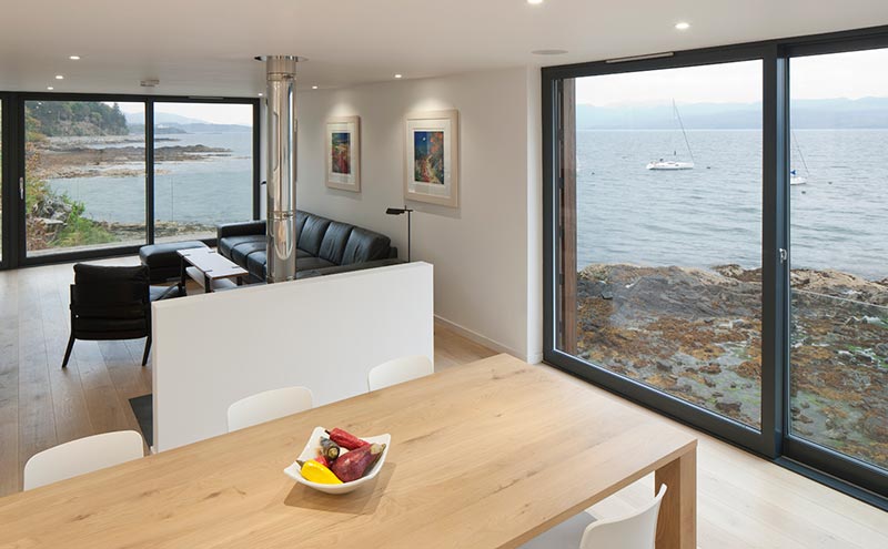 The open-plan living and dining area with its double-aspect sea views