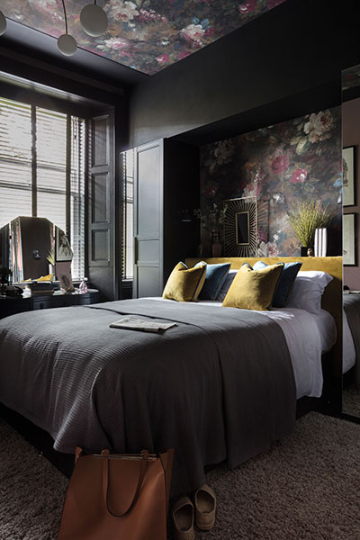 The master bedroom epitomises Cathy Dean’s rich, dark palette