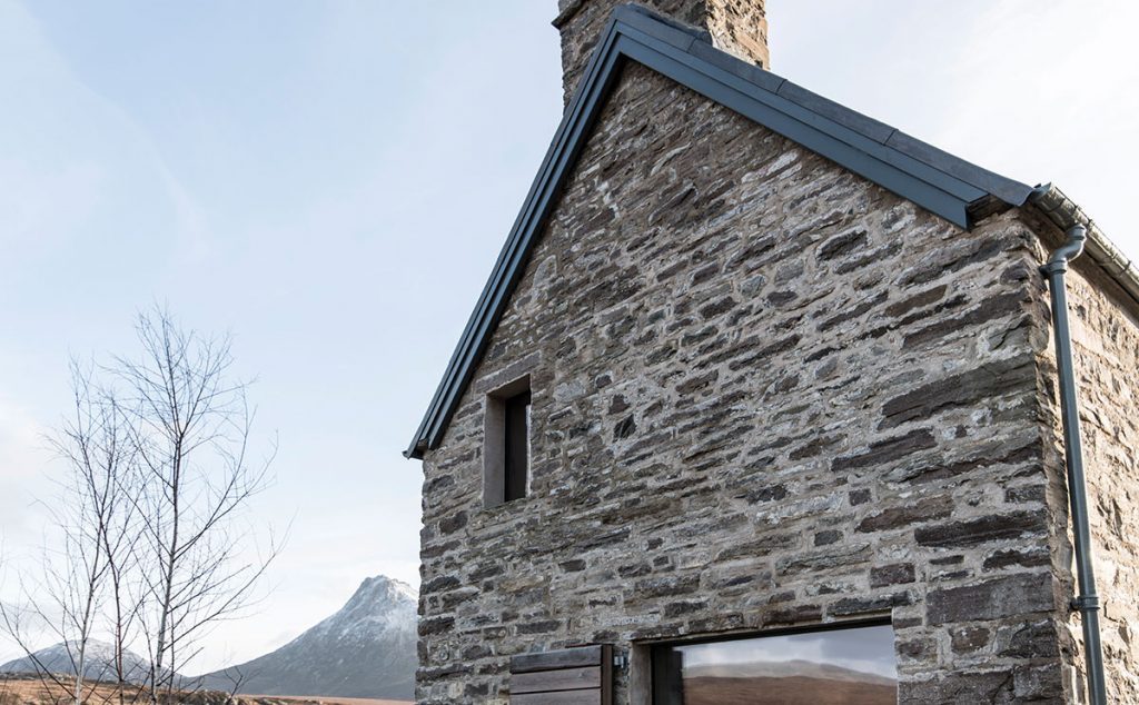 The gable shows the exterior’s reclaimed stone, as well as the new window openings