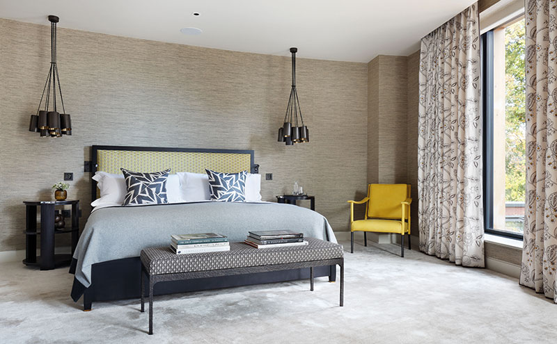 Earthy tones have been used in the principal guest suite, such as the Phillip Jeffries grasscloth on the walls