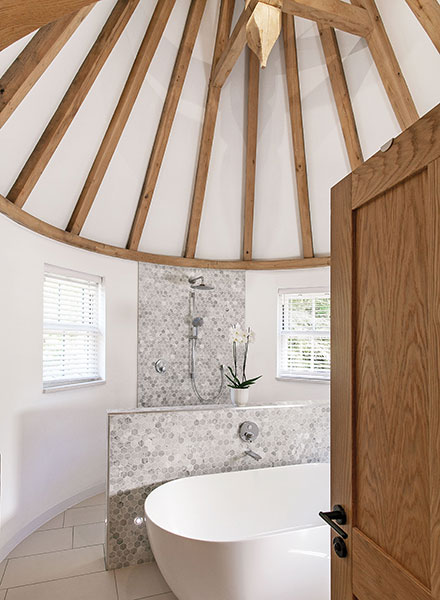 The master en-suite in the turret is particularly striking