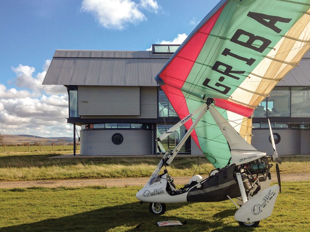 external-shot-of-house-with-microlight-in-front-of-it