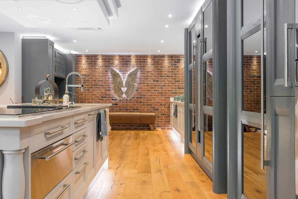 kitchen-with-angel-wings-on-brick-wall