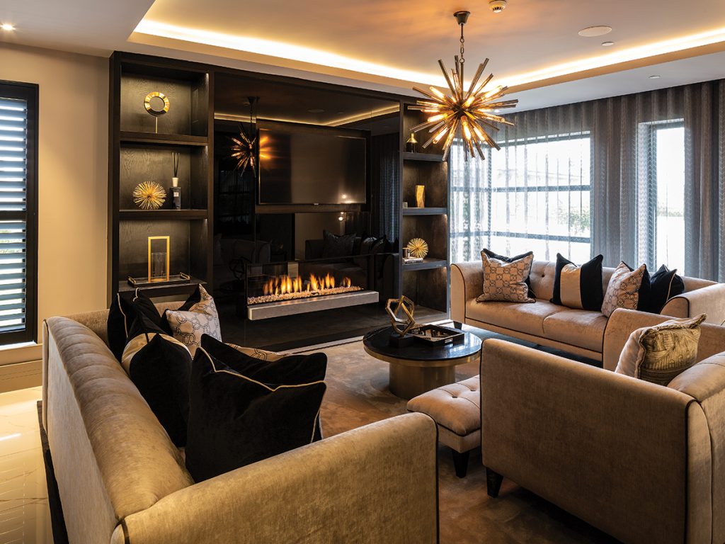 black-and-gold-living-room-with-fire