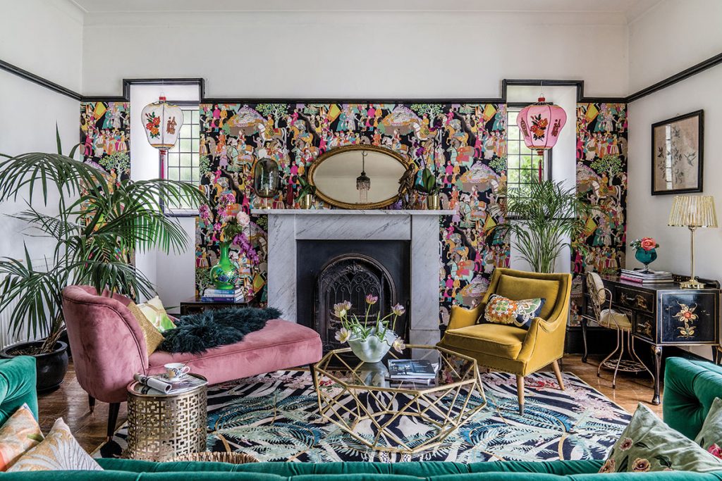 living-room-with-brightly-patterned-wallpaper-and-gold-furniture