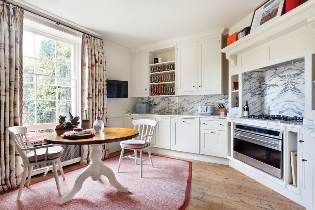 kitchen-with-dining-table-on-rug-in-centre