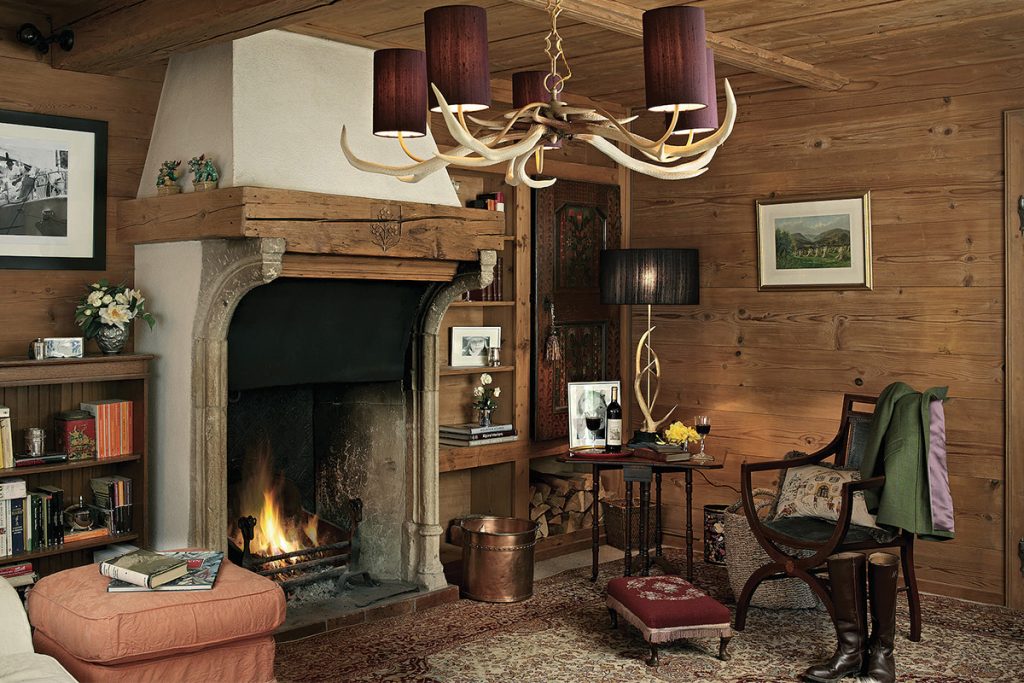 cosy hunting lodge theme lounge with antler chandelier