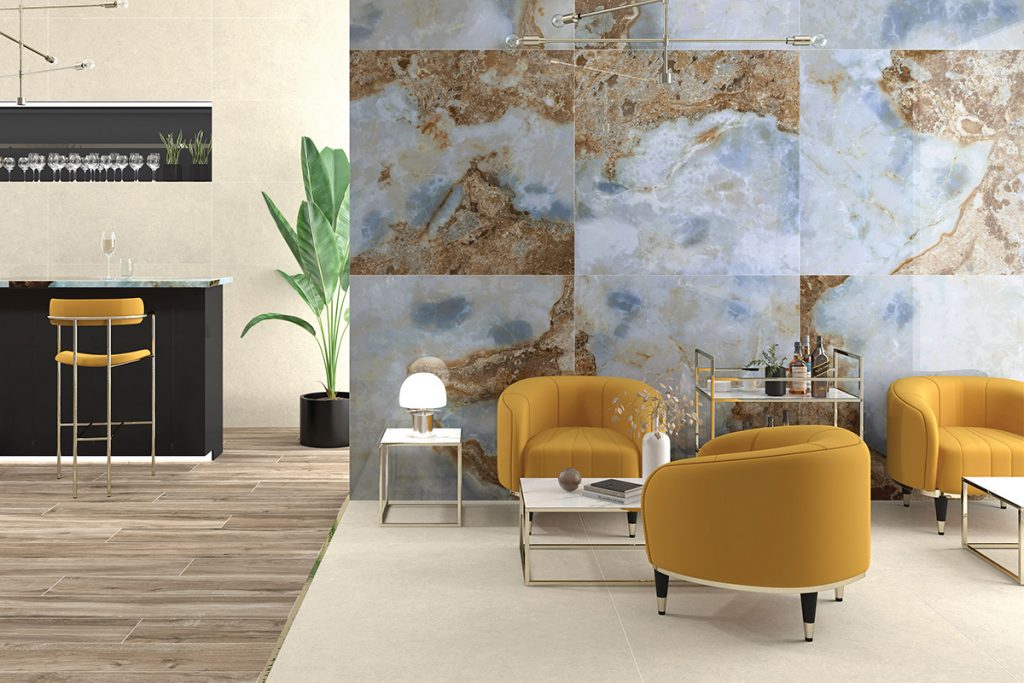 open plan living room with bar area, agate walls and yellow puddle armchairs