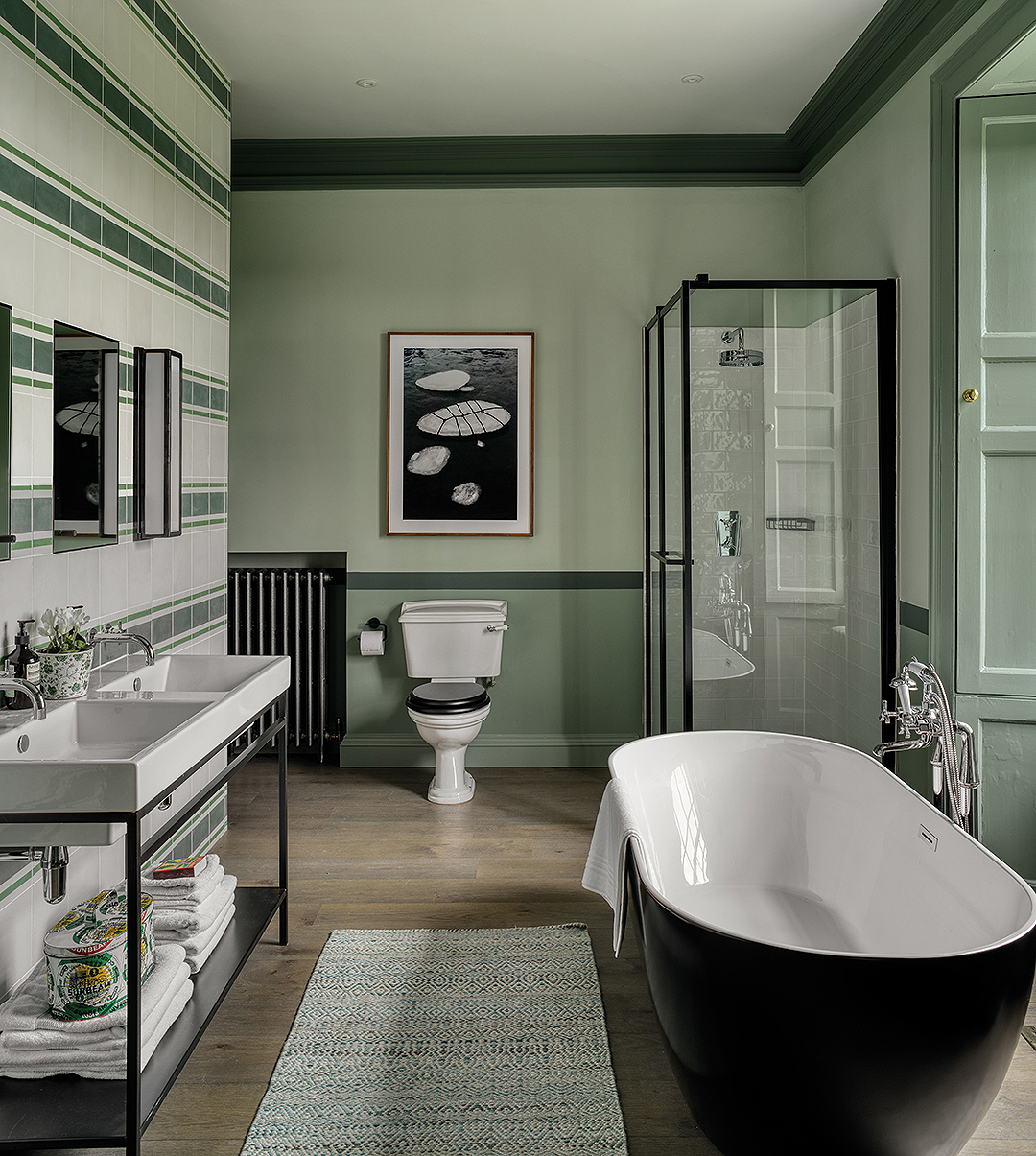 bathroom, green, freestanding bathtub, double vanity sinks, stripes