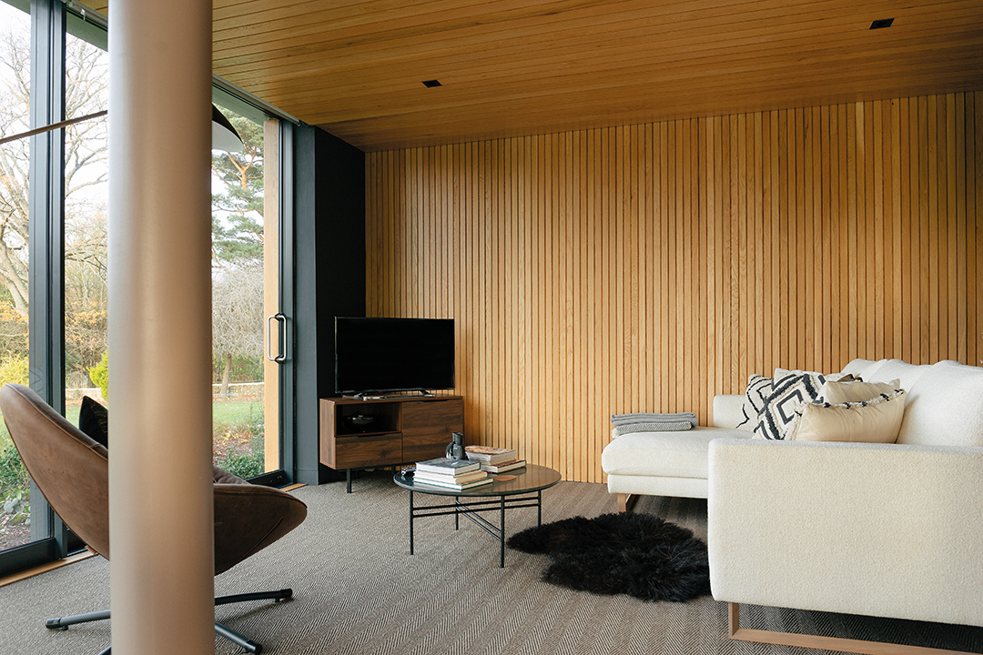 wood panelled walls, TV cream sofa